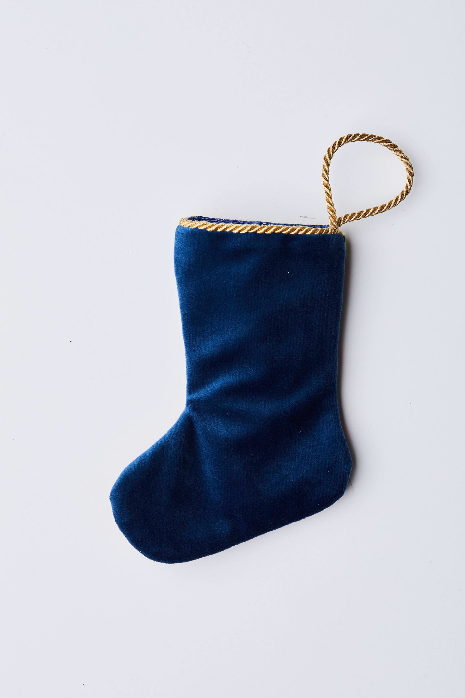 Back view of Gifting Nutcracker needlepoint stocking with solid navy blue velvet backing