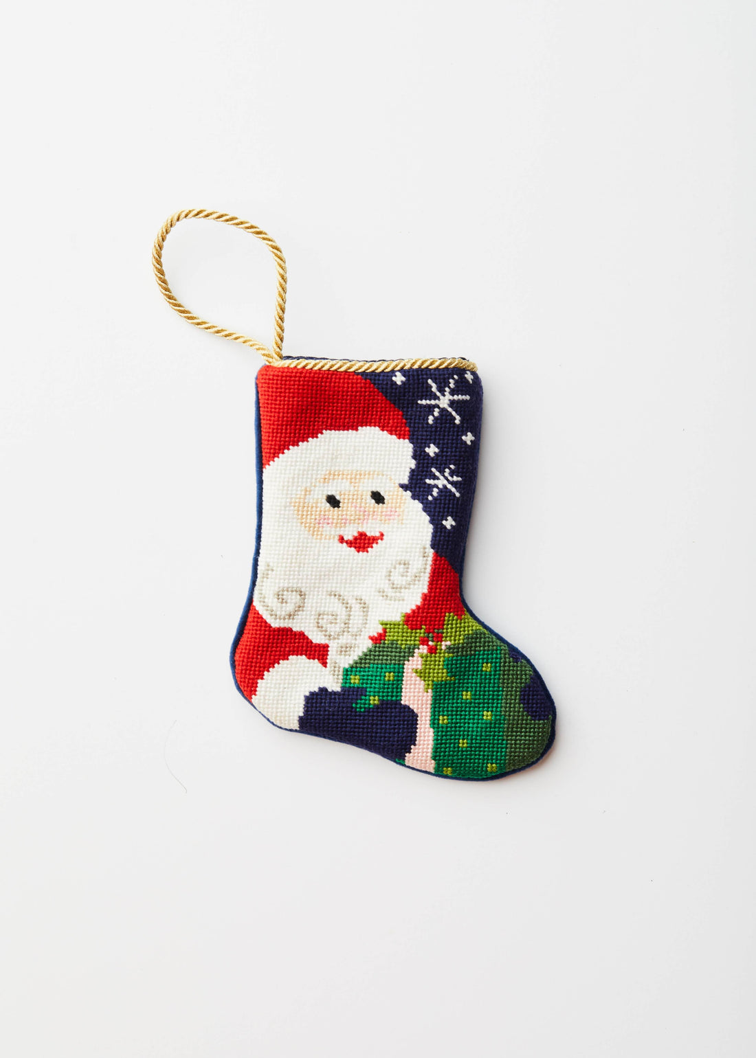 Hand-stitched Christmas stocking with Santa in red suit holding gifts under starry sky