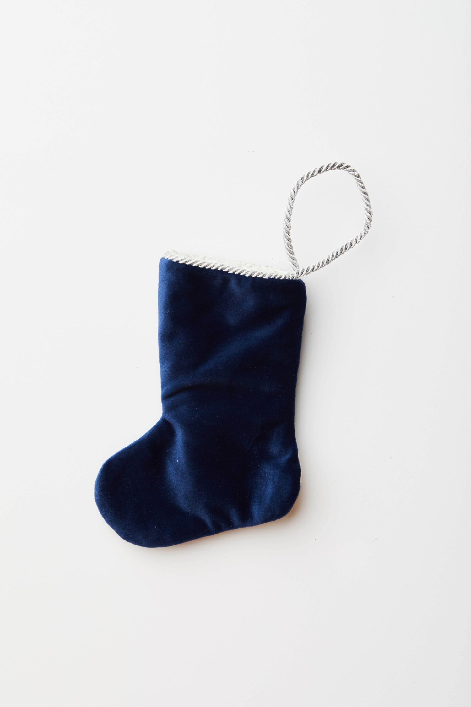 Back view of Jingle Bells needlepoint stocking with solid navy blue velvet backing