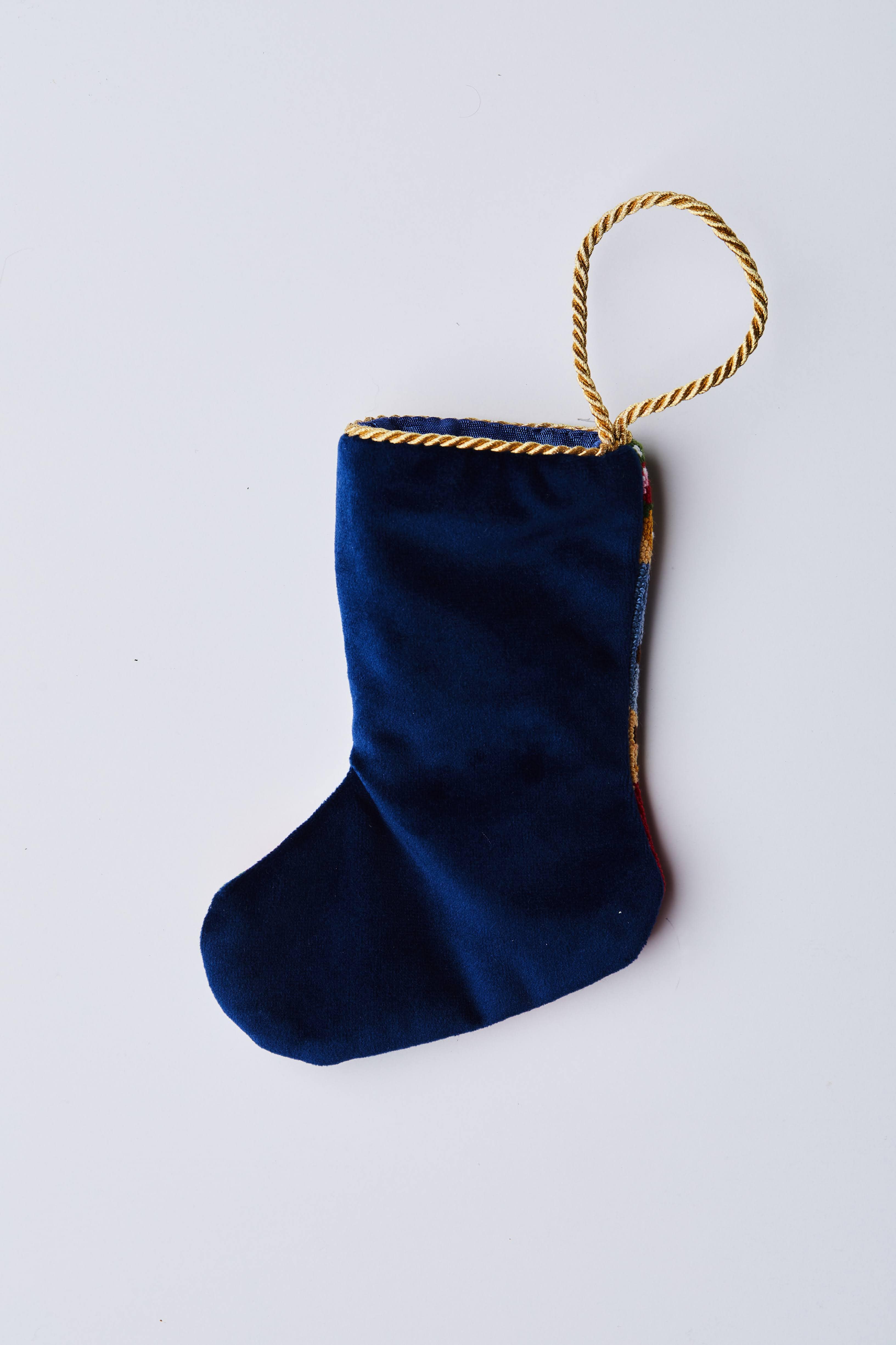 Back view of Jolly Old St. Nick needlepoint stocking with solid navy blue velvet backing