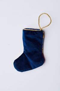Back view of Jolly Old St. Nick needlepoint stocking with solid navy blue velvet backing