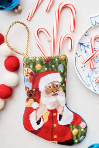 Bauble Stockings styled with candy canes, ornaments, and festive red and blue holiday accents