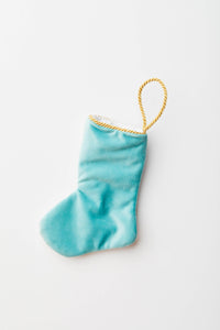 Back view of Let It Snow needlepoint stocking with solid blue velvet backing