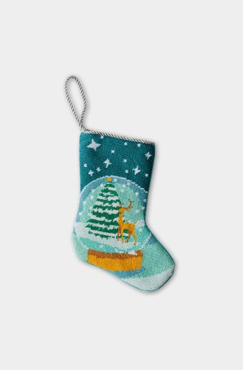 Hand-stitched Christmas stocking with snow globe scene featuring reindeer and Christmas tree under starry sky