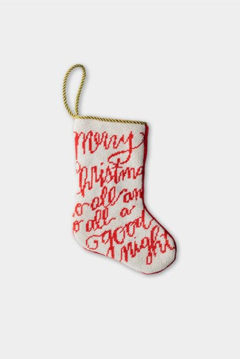 Hand-stitched needlepoint stocking with red script lettering on white background