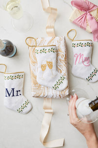 Bauble Stockings displayed alongside Mr. and Champagne Toast stockings with festive wedding-themed accents