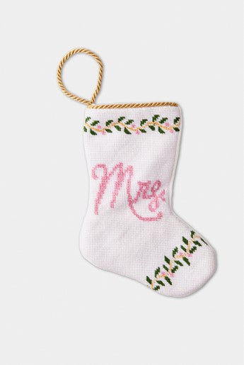 Hand-stitched stocking featuring the Mrs. in pink lettering with green leafy accents on a white background