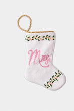 Hand-stitched stocking featuring the Mrs. in pink lettering with green leafy accents on a white background