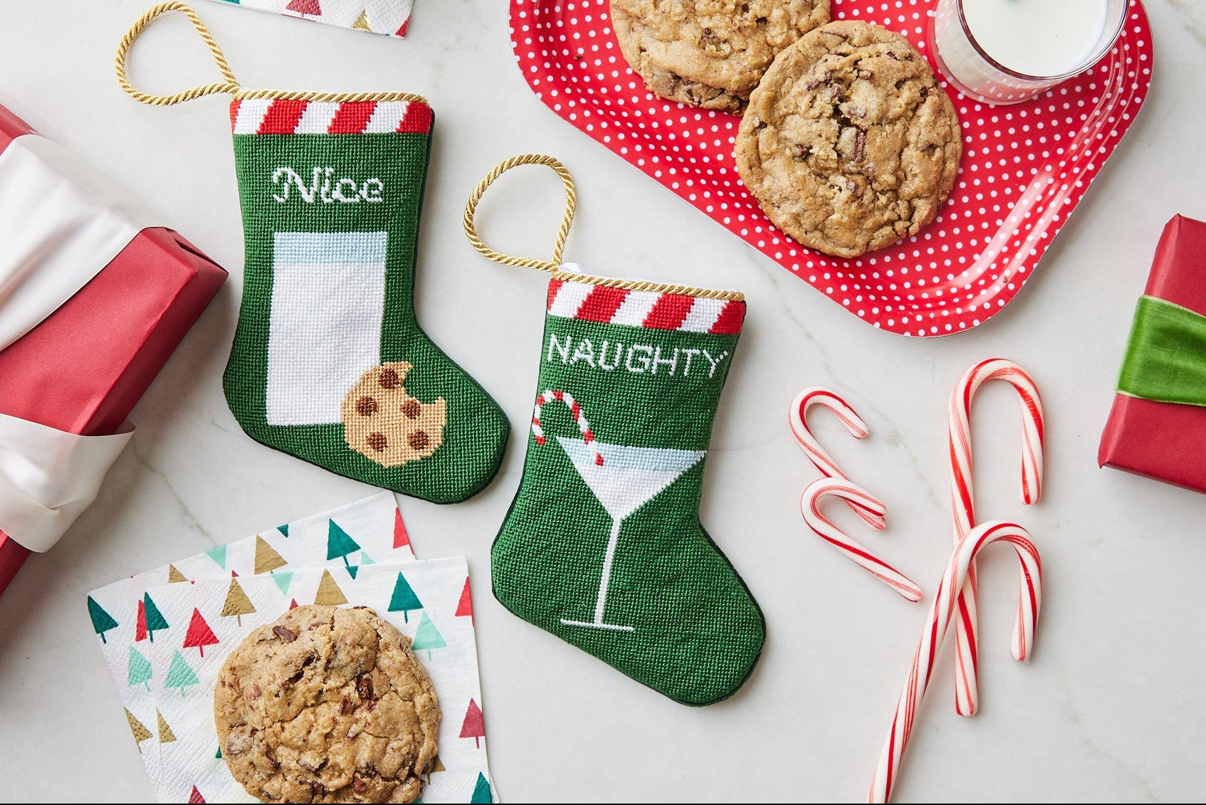Hand-stitched Nice and Naughty Bauble Stockings on festive holiday background