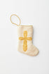 Needlepoint stocking with golden cross on ivory background