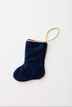 Back view of Sitting Like Royalty in Blue Bauble Stockings with solid navy blue velvet backing