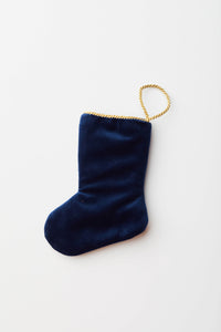 Back view of Sleigh Ride Santa needlepoint stocking with solid navy blue velvet backing