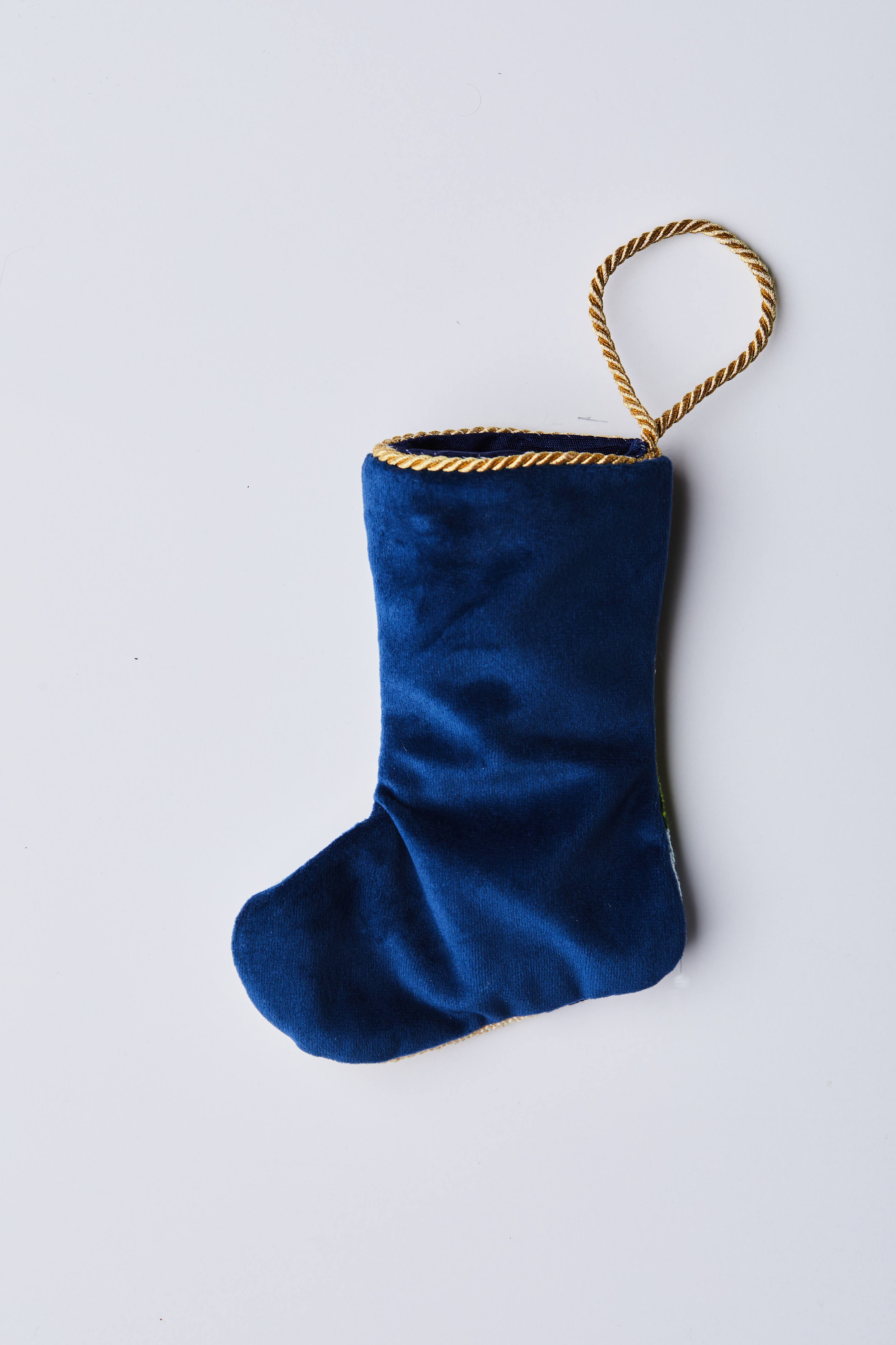 Back view of Winter Solstice Nutcracker needlepoint stocking with solid navy blue velvet backing