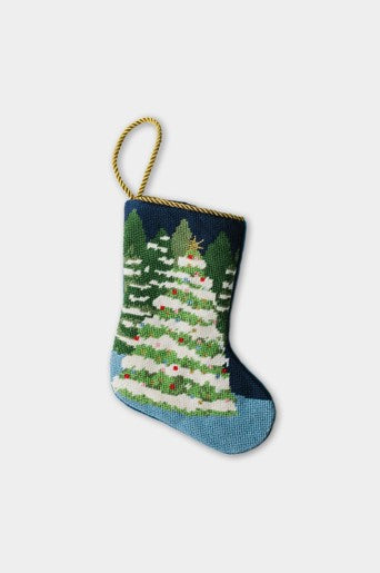 Winter Wonderland needlepoint stocking with snow-covered Christmas trees on a navy blue backdrop